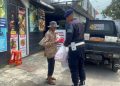 Jumat Berkah, Brimob Polda Bagi-Bagi Makan Gratis di Sumedang